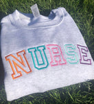 Embroidered Block Letters "Nurse"